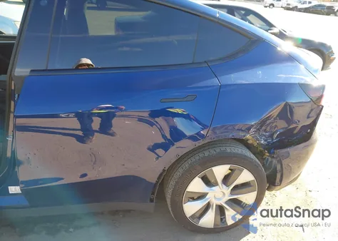 2023 Tesla Model Y Awd/Long Range Dual Motor All-Wheel Drive z USA, uszkodzony, nr VIN 7SAYGDEE3PF596164